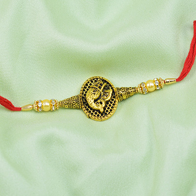 Golden Ganesha Rakhi with Pearls and Beads