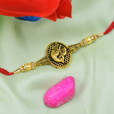 Golden Ganesha Rakhi with Pearls and Beads
