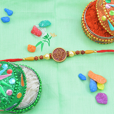 Round Shape Ganesha Rakhi With Pearls and beads