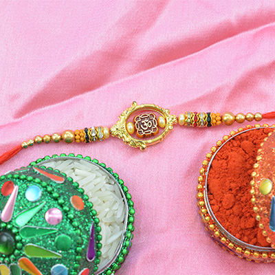Golden work Om Rakhi in Multicolor Beads and Pearls