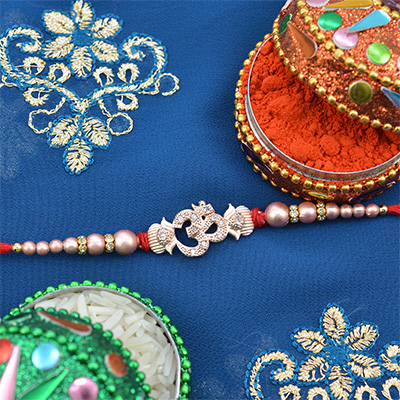 Silver Color Om Rakhi With Pearls and Diamonds