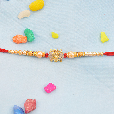 Beautiful Combination of Gold and Silver Rakhi with Pearls