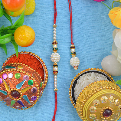 Beautiful Pearls With Diamonds Rakhi set