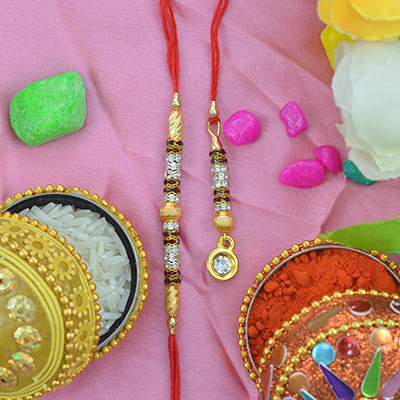 Golden Designed Rakhi With Studded Diamonds