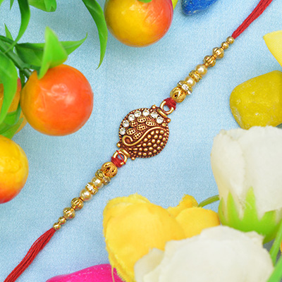 Red Designing with Jewel and Golden Beads Rakhi