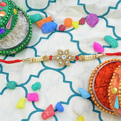 White and Golden Beads with Floral and Jewel in the Middle Rakhi