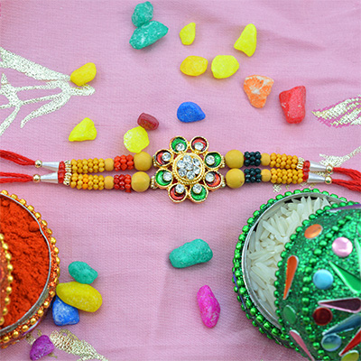 Sandalwood Type Beads Rakhi with Jewel Studded on Floral