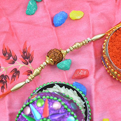 Golden Beads Thread Rakhi with Rudraksha in the Middle