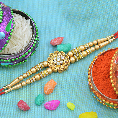 Stunning looking Floral Shaped Golden Beads Rakhi