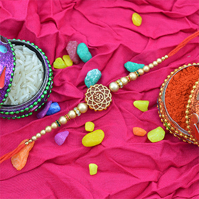 Sacred Om Rakhi with Multiple Beads and Jewels