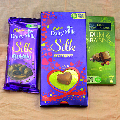 Delightful Cadbury Combo of Silk Bubbly, Rum Raisns and Heart Pop 