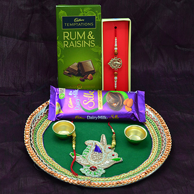 Temptations Rum Raisins and Silk Chocolate with Rakhis and Puja Thali Hamper