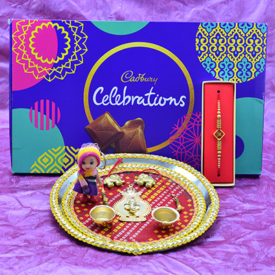 Cadbury Big Celebration Chocolates Hamper with Kid and Bhai Rakhi along with Ganesha Sacred Rakhi Puja Thali