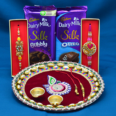 Cadbury Dairy Milk Bubbly and Oreo with Elegant Looking Maroon Base Rakhi Pooja Thali