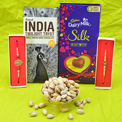 Dairy Milk Silk and Amul Tryst Chocolate Hamper with 2 Brother Rakhis and Pista Dry Fruit