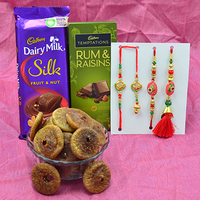 2 Bhaiya Bhabhi Rakhi Set with Cadbury Silk and Rum Raisins Chocolates and Anjeer Dry Fruit