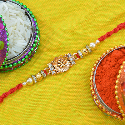 Flower in Mid with Jewel and Beads in it Designer Rakhi