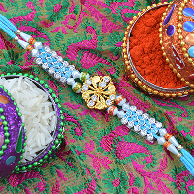 Sky Blue Colored Golden Butterfly and Beads Designer Rakhi