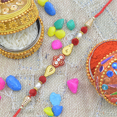 Small Red Flower in Mid with Differently Shaped Beads Fancy Rakhi 