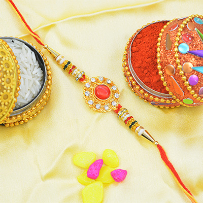 Kundan in Mid with Rounded Jewels on Golden Base Kundan Meena Rakhi