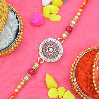 Flower in the Middle of Coin Shaped Pink Colored Rakhi