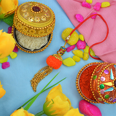Hanging Golden Small Nice Looking Chain with Soft Orange Lumba Rakhi