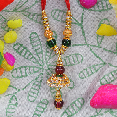 Shining Berry Type Beads and Golden Work Amazing Lumba Rakhi