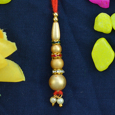 Golden Beads with Tri Color Jewels Red Threaded Lumba Rakhi for Bhabhi
