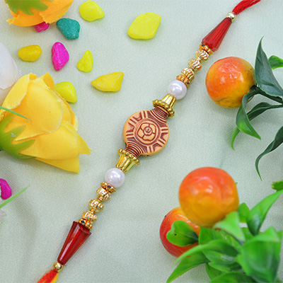 Amazing Art Work on Rounded Rakhi with Rich look Beads