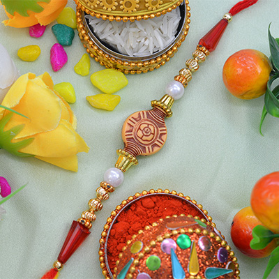 Amazing Art Work on Rounded Rakhi with Rich look Beads