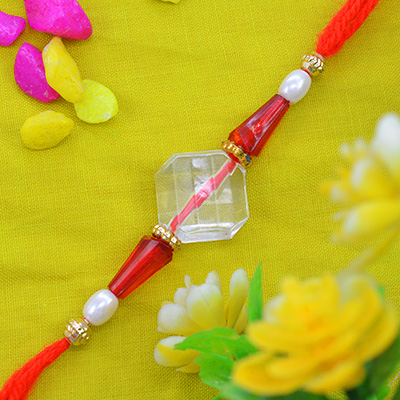 Fascinating Transparent Pearl Rakhi with Awesome Silk Thread
