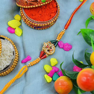 Stunning Golden Diamond Ganesh with Beautiful Sandalwood Beads and Stylish Silk Thread