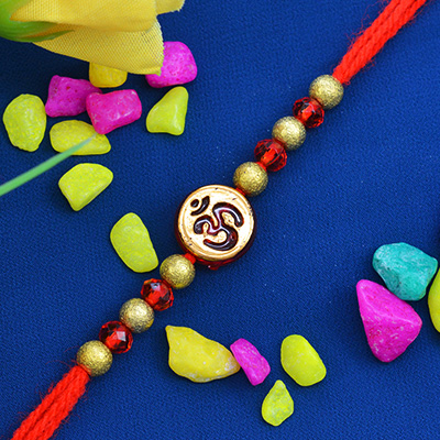 Beautiful and Miraculous Rounded Golden OM Moli-Dori Rakhi with Graceful Beads