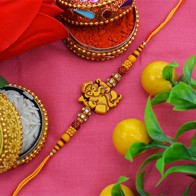 Alluring Sandalwood Moli Rakhi with Graceful Pearls and Soft Silky Thread