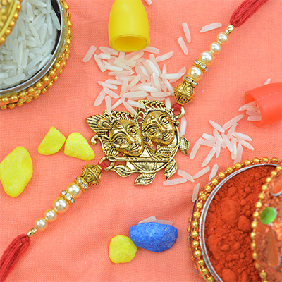 Amazing Radha-Krishna Pearl Rakhi with Golden Beads 