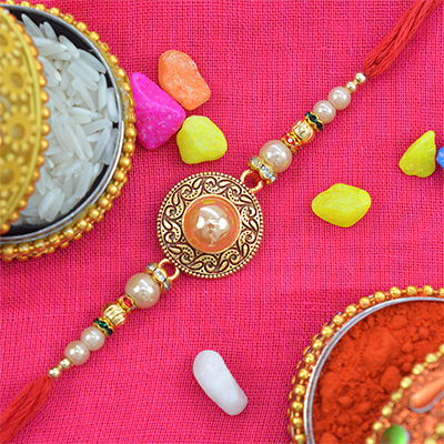 Marvelous Golden Beads Studded in Rounded Rakhi with Shining White Pearls