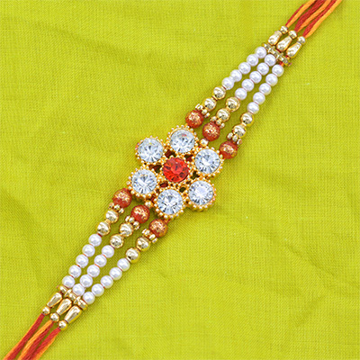 Fascinating Flower Shape Diamonds and Jewel Pearl Rakhi with Colorful Thread