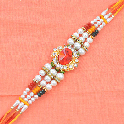 Stunning Red Diamond Studded in Golden Rounded Shape with Multicolor Pearls in Colorful Silky Thread