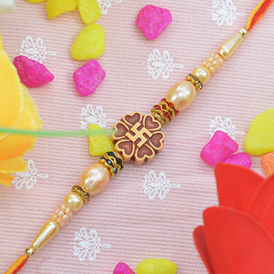 Attractive Swastik Studded in Flower Shape Heart with Graceful Golden Beads in Silk Thread