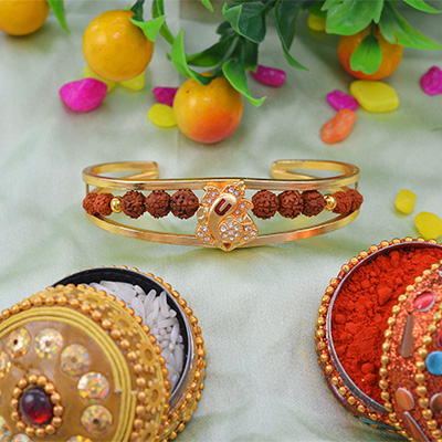 Amazing Golden Diamond Ganesh Rakhi Bracelet with Unique Rudraksha
