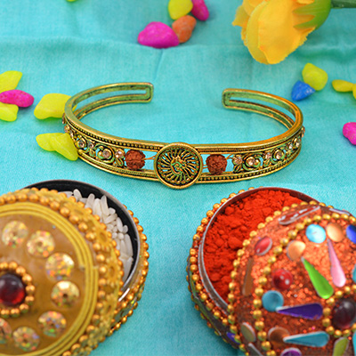Astounding Rounded OM Rakhi Bracelet with Two Rudraksha and Diamonds