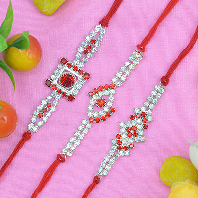 Marvelous Trio of 3 Brother Jewel Rakhi with Jewel Studded and Red Dori