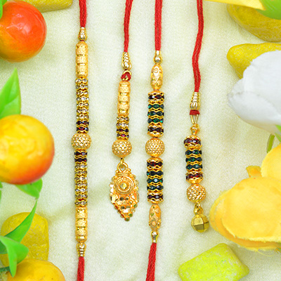 Fascinating Golden Colored Black Jewel Studded Beads 2 Bhaiya and 2 Bhabhi Rakhi Set of 4