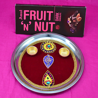 Amul Fruit and Nut Chocolate with Simple Looking Maroon Color Rakhi Puja Thali