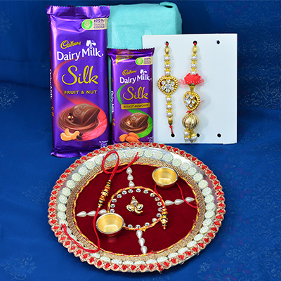 Dairy Milk Silk Chocolates with Rakhis and Rich Looking Lord Ganesha Studded Rakhi Puja Thali