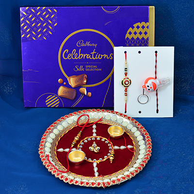 New Celebration Pack of Cadbury Chocolates with Beautiful Rakhis and Sacred Ganesha Pooja Thali