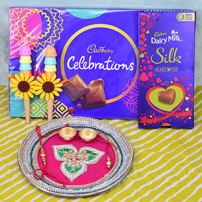 Silk Heart Pop and Cadbury Celebration Chocolates with Amazing Looking Pink Color Heavy Rakhi Thali