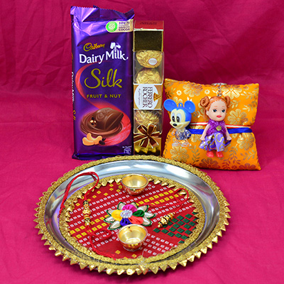 Dairy Milk Silk Fruit and Nut and Ferrero Rocher 4 Pc Chocolate with Family Rakhis and Pooja Thali for Raksha Bandhan