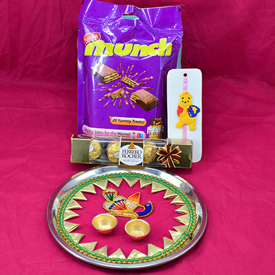 Munch Chocolates Pack with Ferrero Rocher 4 Pc and Peacock Designer Amazing Pink Base Rakhi Puja Thali