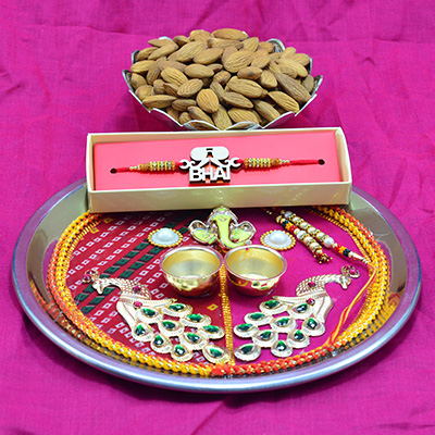 Fancy Bhai Rakhi with Fresh Badam Dry Fruit and Awesome Looking Ganesha and Peacock Studded Pooja Thali